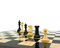 Old English Elite Series Ebony Staunton Chess Pieces 4 Inch Set on Chessboard